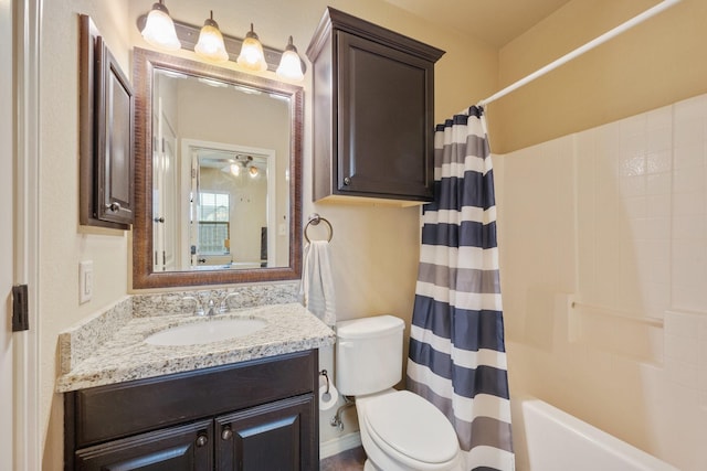 full bathroom with vanity, shower / bath combination with curtain, and toilet