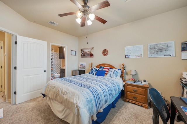 carpeted bedroom featuring connected bathroom and ceiling fan