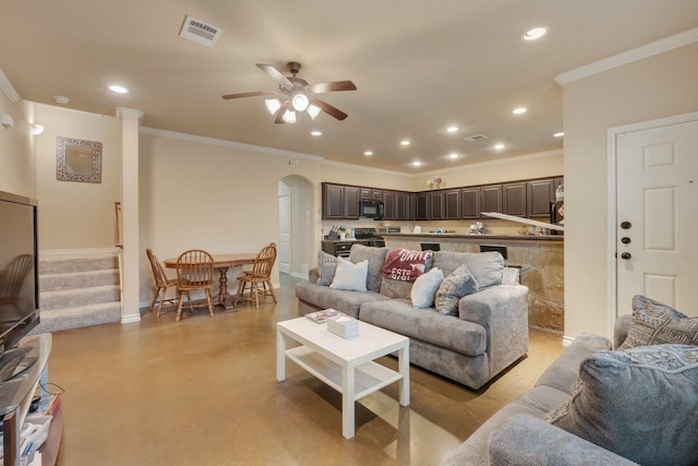 living room featuring crown molding and ceiling fan