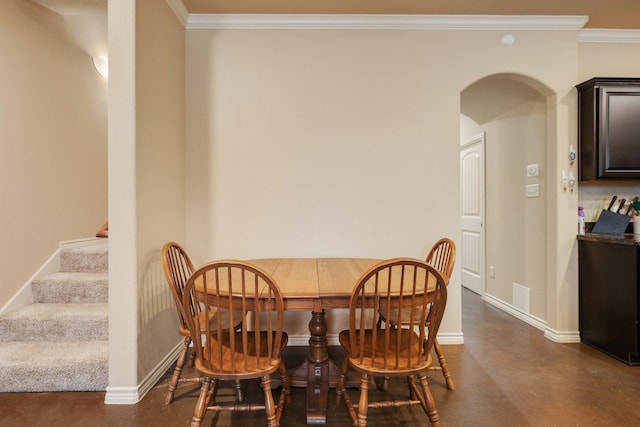 dining area featuring ornamental molding