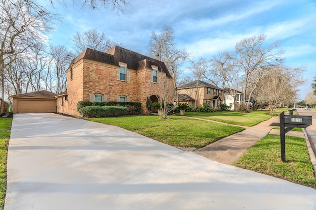 view of front of house with a garage and a front yard