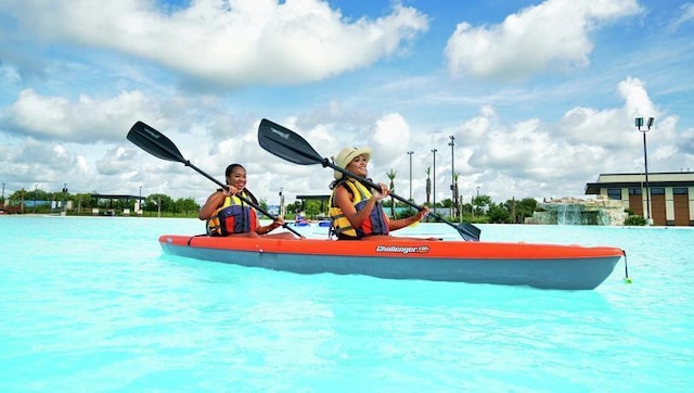 surrounding community with a water view