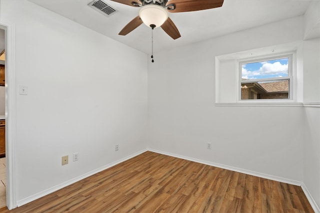 spare room featuring ceiling fan and wood-type flooring