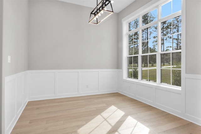 unfurnished dining area featuring light hardwood / wood-style floors