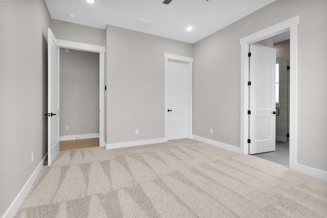 unfurnished bedroom featuring light colored carpet