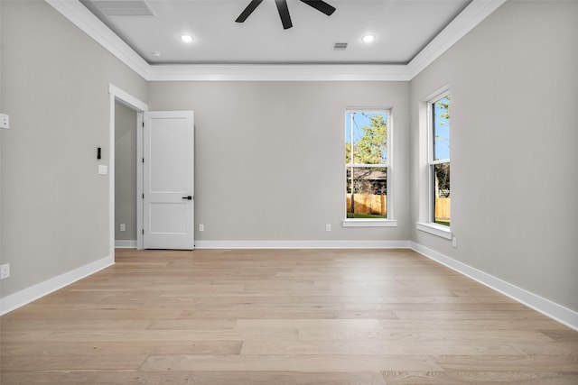 spare room featuring crown molding, ceiling fan, and light hardwood / wood-style floors