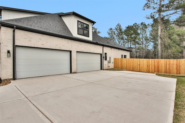 view of side of home with a garage