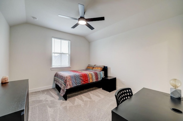 bedroom with ceiling fan, vaulted ceiling, and light carpet