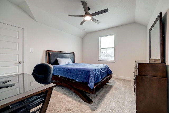 bedroom featuring vaulted ceiling, light carpet, and ceiling fan