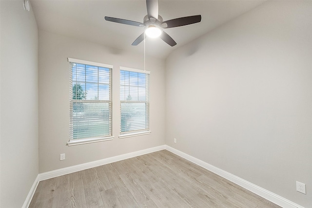 unfurnished room featuring a ceiling fan, baseboards, and light wood finished floors