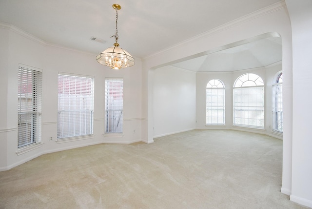 carpeted empty room with ornamental molding and a chandelier