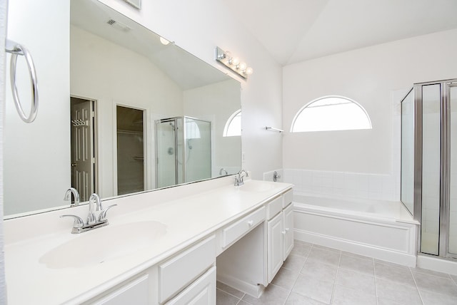 bathroom with tile patterned flooring, plus walk in shower, lofted ceiling, and vanity