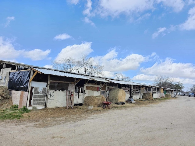 exterior space featuring an outbuilding