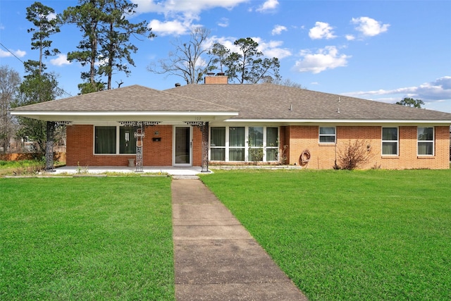 ranch-style home featuring a front yard