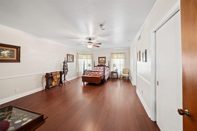 bedroom with crown molding and dark hardwood / wood-style flooring