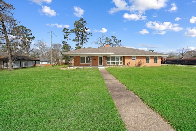 ranch-style home featuring a front yard