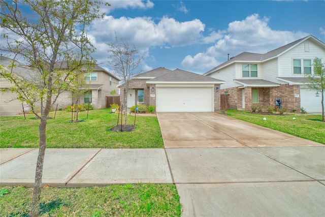 view of front of property with a garage and a front yard