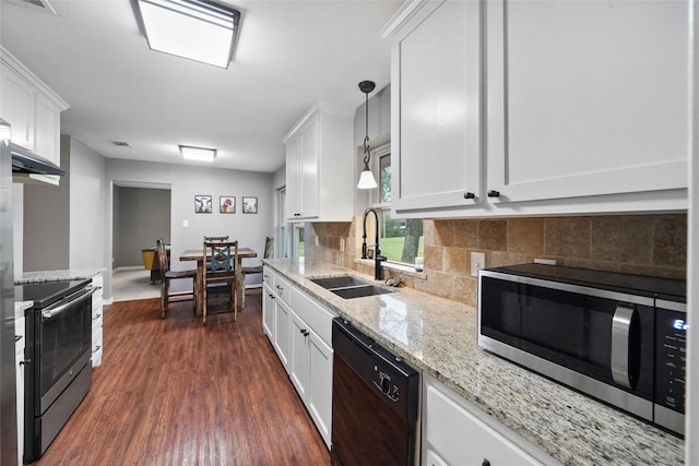 kitchen with white cabinetry, stainless steel appliances, decorative light fixtures, and sink