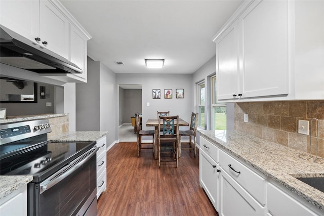 kitchen with backsplash, dark hardwood / wood-style floors, stainless steel range with electric cooktop, and white cabinets