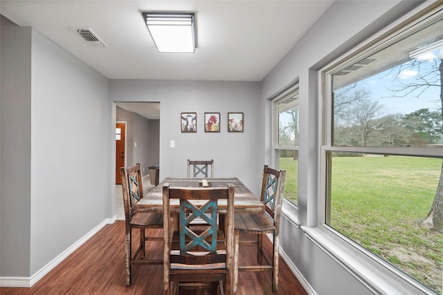 dining room featuring dark hardwood / wood-style flooring