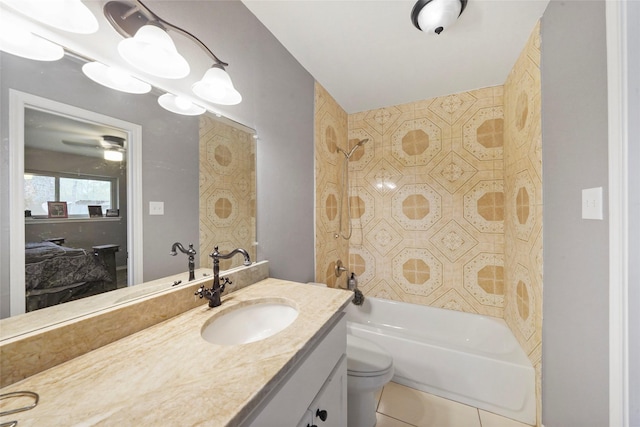 full bathroom with vanity, tile patterned floors, toilet, and tiled shower / bath