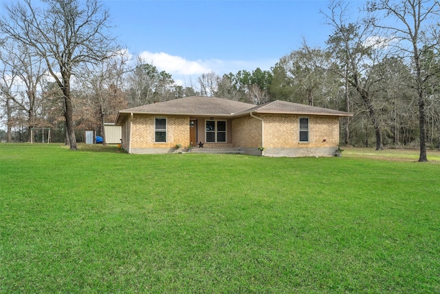 ranch-style home with a front lawn