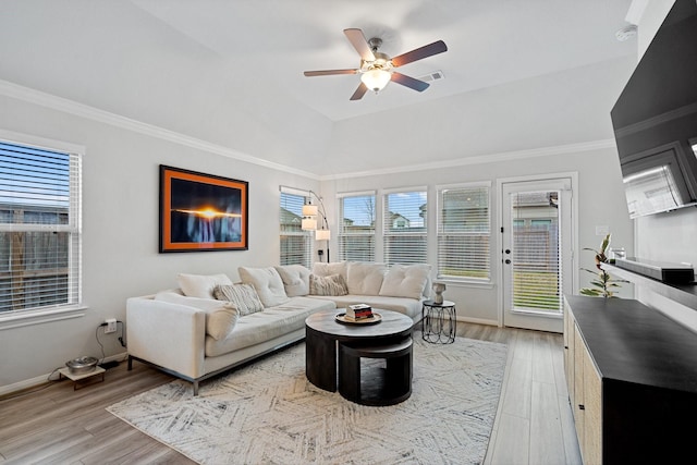 living room with light hardwood / wood-style flooring, ornamental molding, and ceiling fan