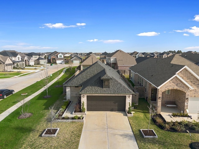 view of front of home featuring a garage and a front yard