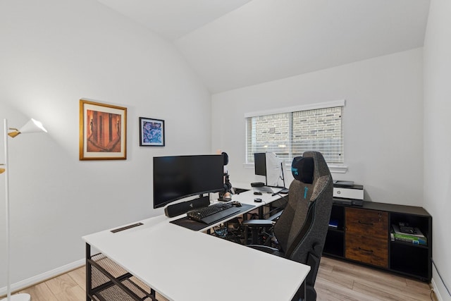 office area featuring lofted ceiling and light hardwood / wood-style floors