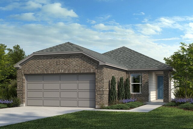 view of front of property with a garage and a front lawn