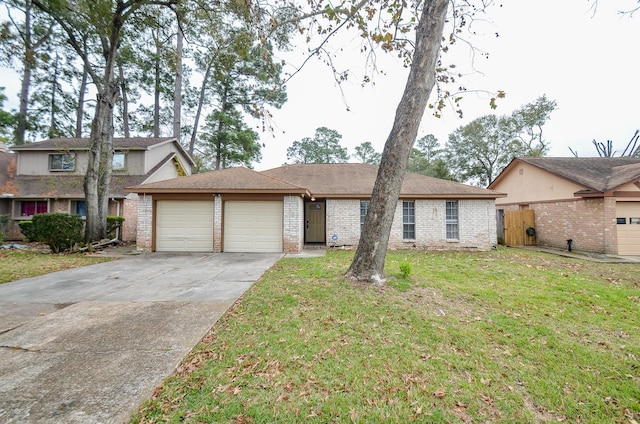 view of front of house featuring an attached garage, a front yard, concrete driveway, and brick siding