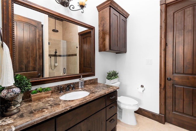 full bath with a stall shower, baseboards, toilet, tile patterned floors, and vanity