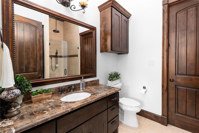 146 La Vie Dr, Montgomery, TX 77316 - bathroom featuring tile patterned flooring, vanity, toilet, baseboards, and a stall shower