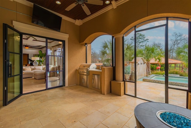 interior space with ceiling fan