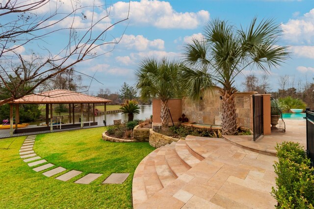 view of yard with a gazebo, a patio area, and a pool