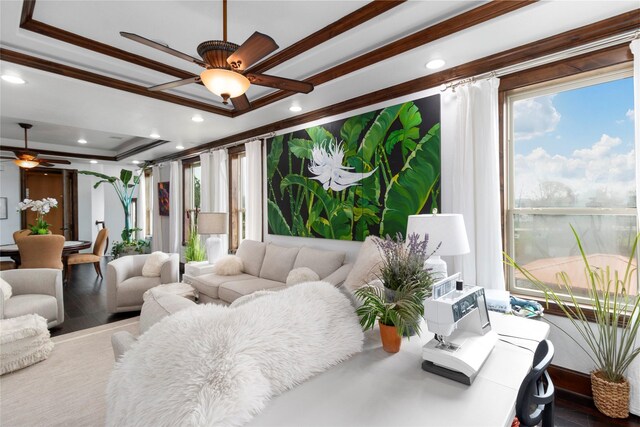 living room featuring crown molding, recessed lighting, a raised ceiling, and ceiling fan