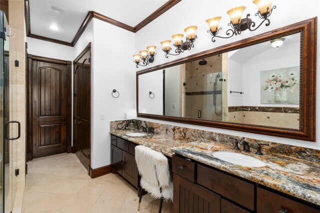 full bath with double vanity, ornamental molding, a stall shower, and a sink