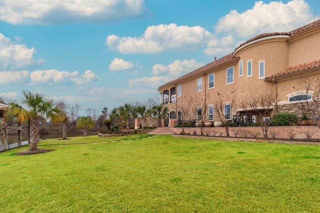 view of home's community with a lawn