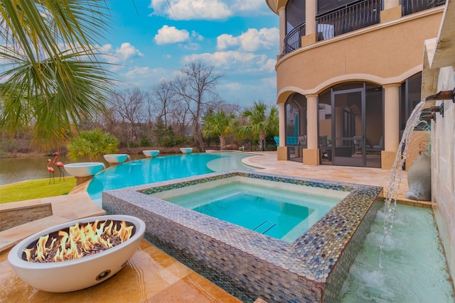 146 La Vie Dr, Montgomery, TX 77316 - view of swimming pool featuring an outdoor fire pit, a pool with connected hot tub, and a patio