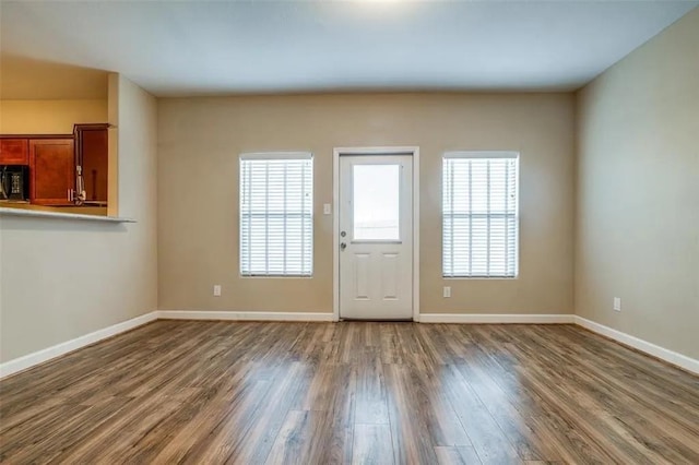 interior space featuring hardwood / wood-style flooring and a wealth of natural light