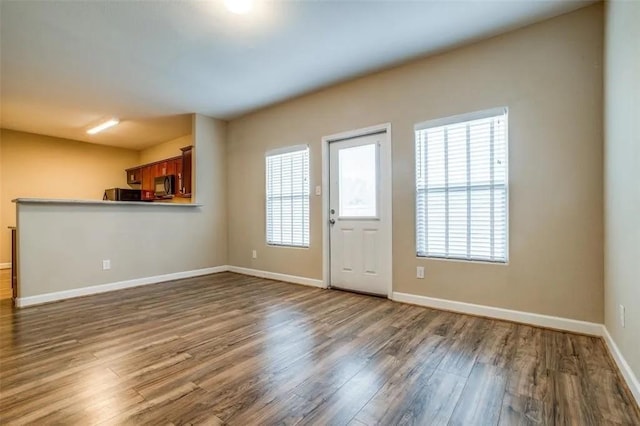 interior space featuring dark hardwood / wood-style floors and a wealth of natural light