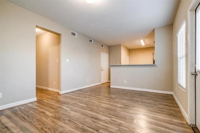 spare room featuring hardwood / wood-style floors