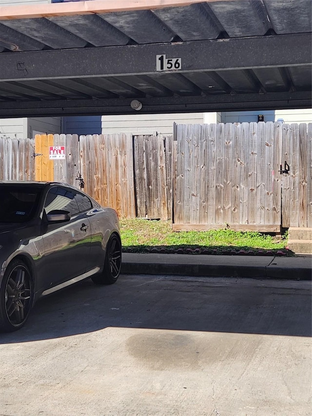 view of vehicle parking featuring a carport