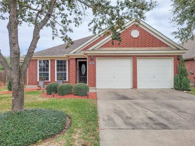 view of front of house featuring a garage and a front yard