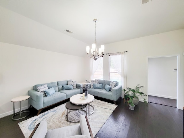 living room with lofted ceiling, dark hardwood / wood-style flooring, and a notable chandelier