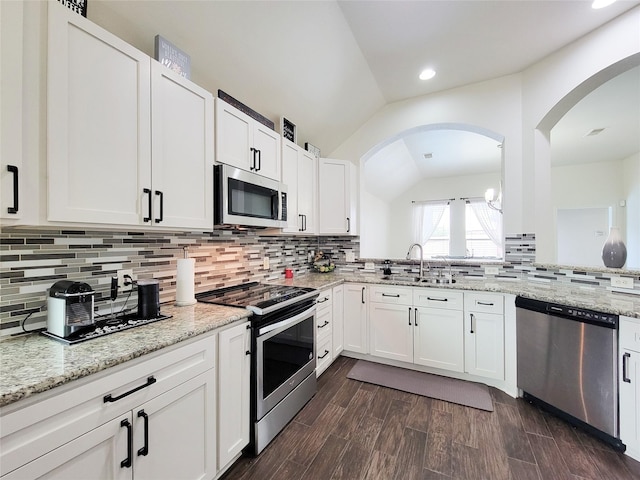 kitchen featuring appliances with stainless steel finishes, white cabinetry, and sink