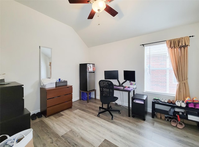 office with light hardwood / wood-style floors, lofted ceiling, and ceiling fan