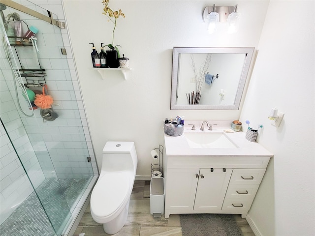 bathroom featuring vanity, toilet, and walk in shower