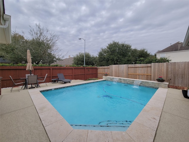 view of pool featuring a patio