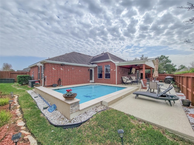 view of pool with central AC unit, ceiling fan, and a patio area